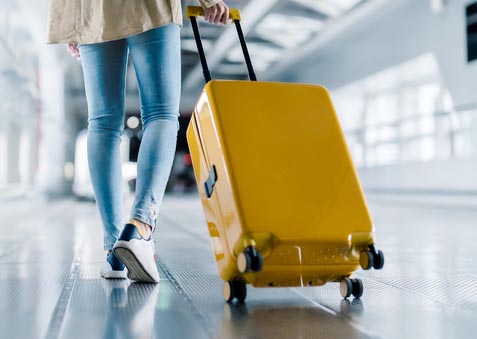 International airport terminal. Asian beautiful woman with luggage and walking in airport